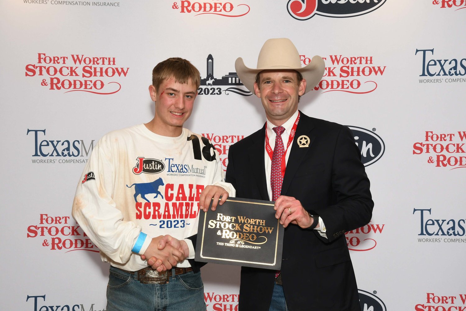 Mason Williams of Quitman FFA won a $500 purchase certificate in the Fort Worth Stock Show & Rodeo calf scramble Jan. 28 toward a beef or dairy heifer for a 4-H or FFA project for exhibition at next year’s show. The certificate, presented by Stock Show Calf Scramble Committee member, Paxton Motheral, was sponsored by Payton and Lindsay Reese. Williams’s mother is Marlena Gallender of Quitman.